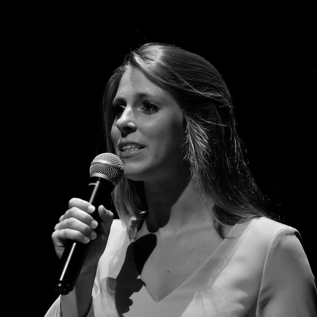 Field reporter speaking into a microphone during a live report