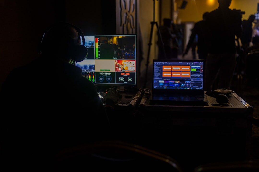 Newsroom control room with editors working on live broadcast feeds